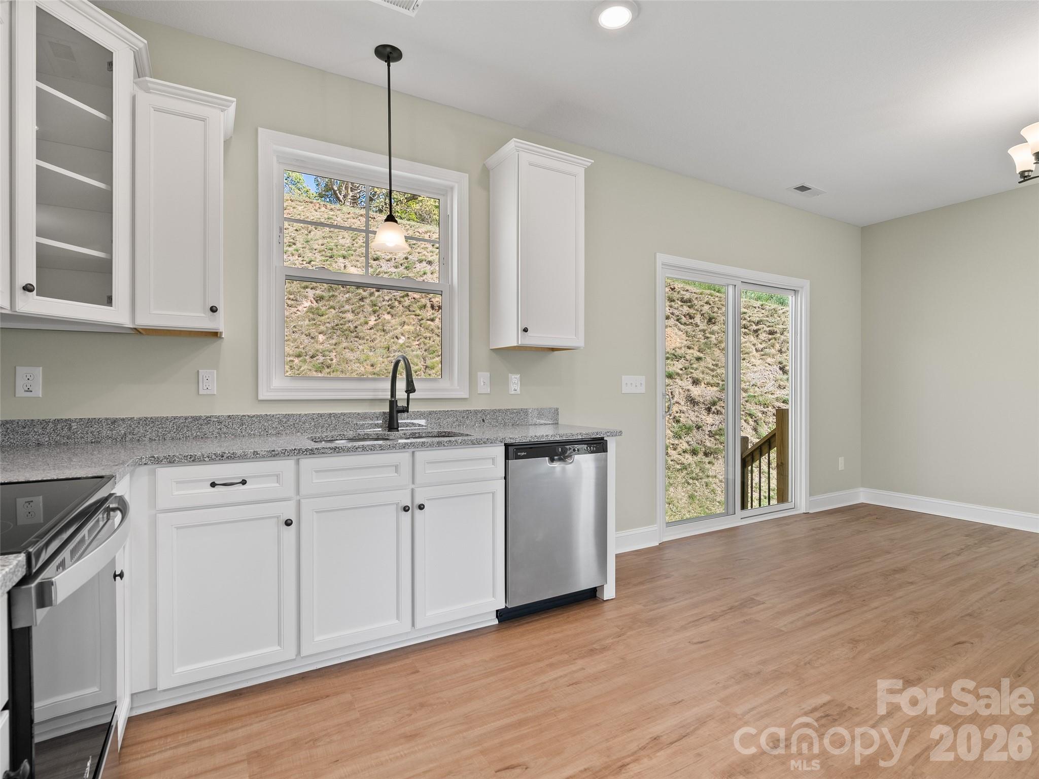 373 Barefoot Ridge Clyde, NC 28721 - Photo 15 of 30 a kitchen with a sink cabinets and window