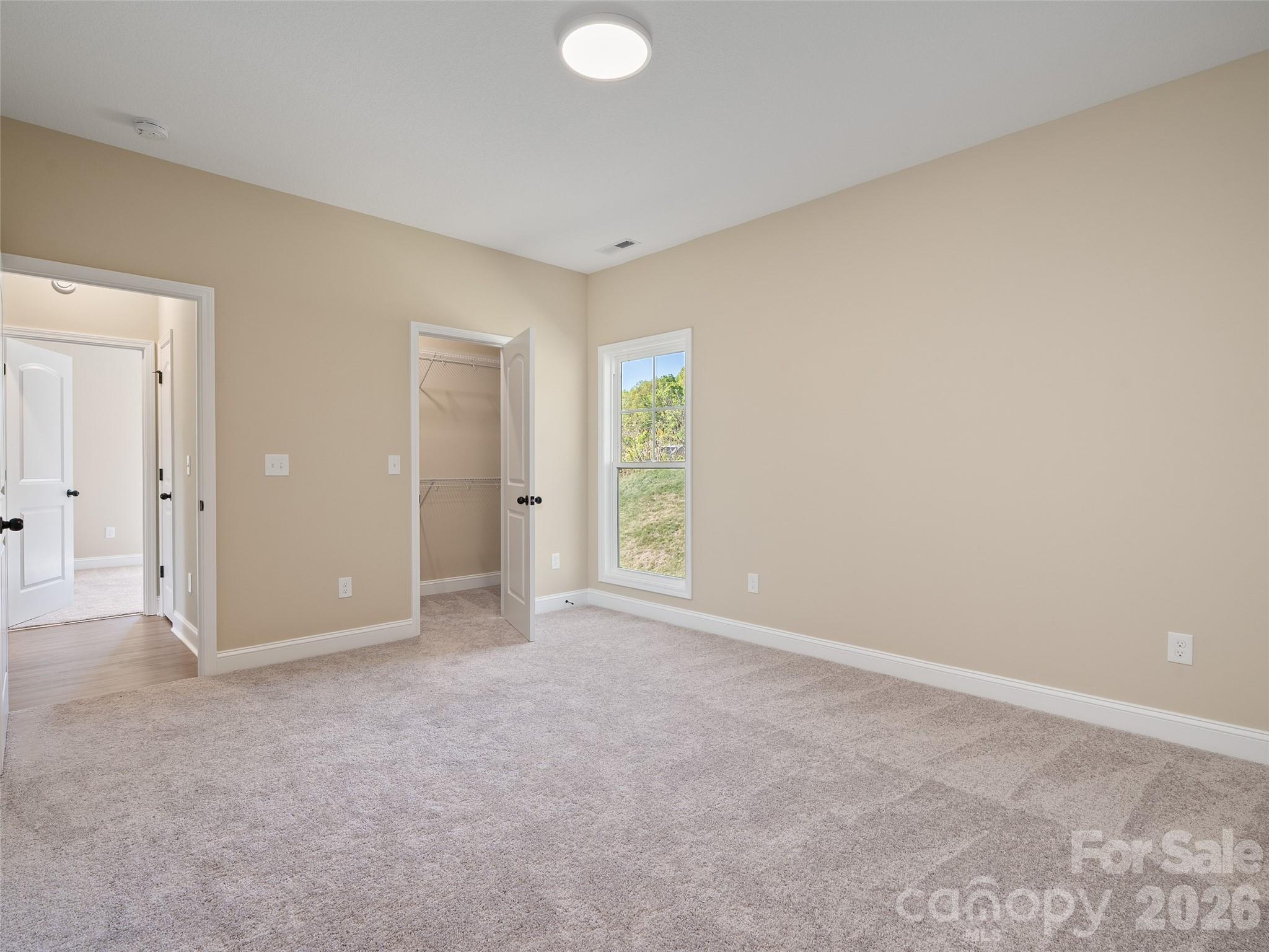 373 Barefoot Ridge Clyde, NC 28721 - Photo 17 of 30 a view of an empty room with window and closet area