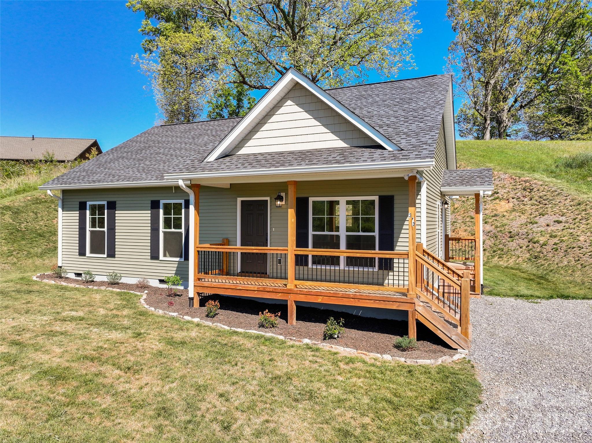 373 Barefoot Ridge Clyde, NC 28721 - Photo 2 of 30 a house with trees in the background