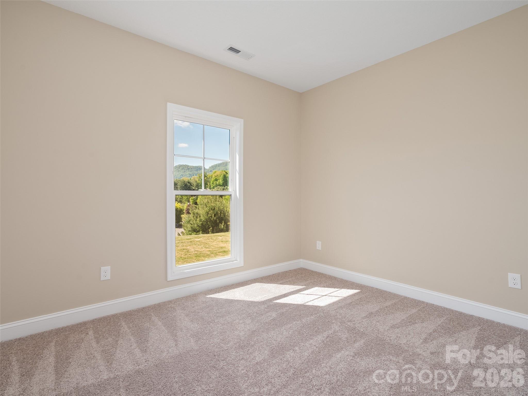 373 Barefoot Ridge Clyde, NC 28721 - Photo 22 of 30 an empty room with a window