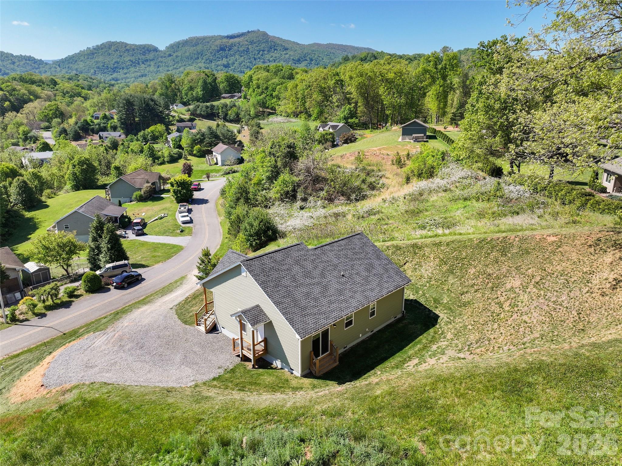 373 Barefoot Ridge Clyde, NC 28721 - Photo 28 of 30 a view of a houses with a yard