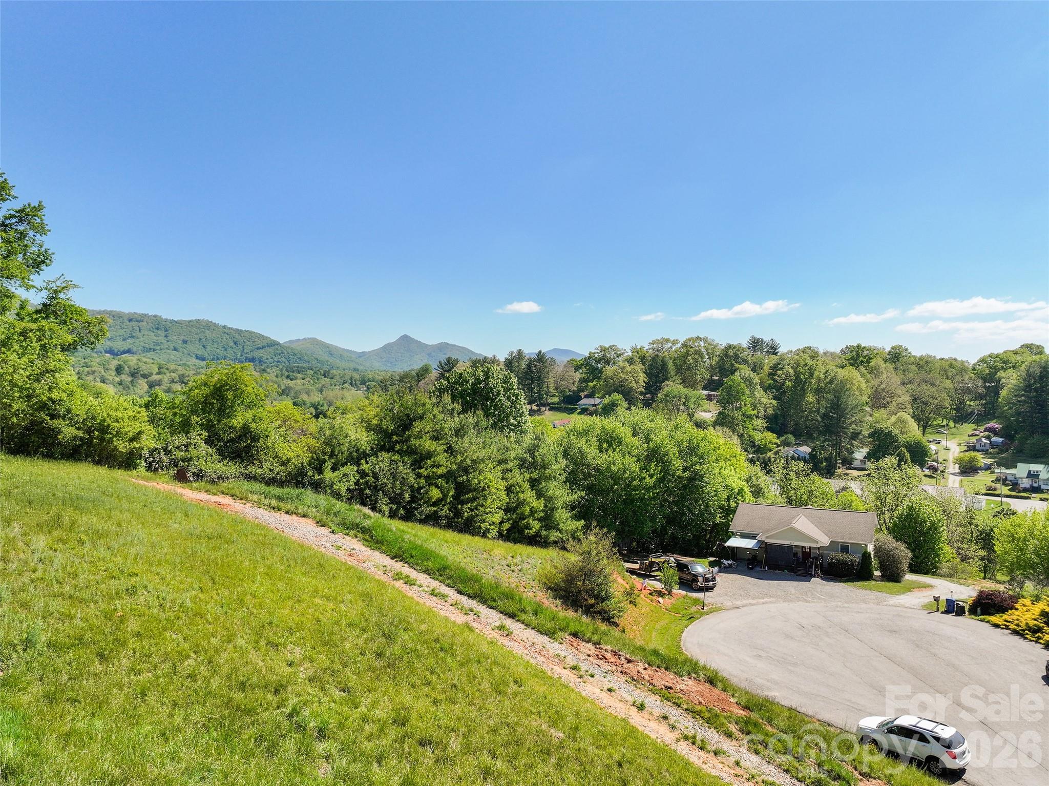 373 Barefoot Ridge Clyde, NC 28721 - Photo 5 of 30 a view of a lake with a mountain