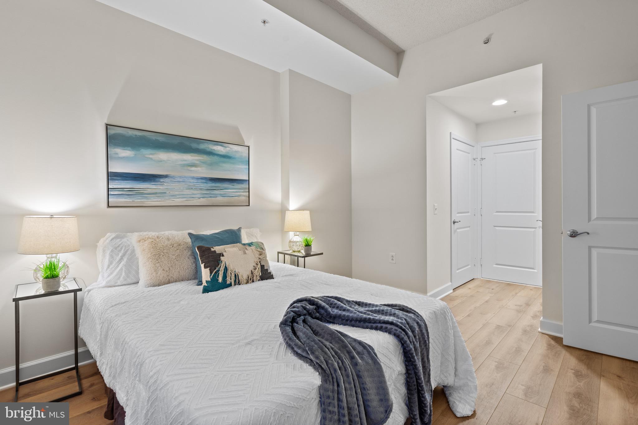 3650 South Glebe Road, Unit 1147 Arlington, VA 22202 - Photo 12 of 51 a bedroom with a bed and a painting on the wall