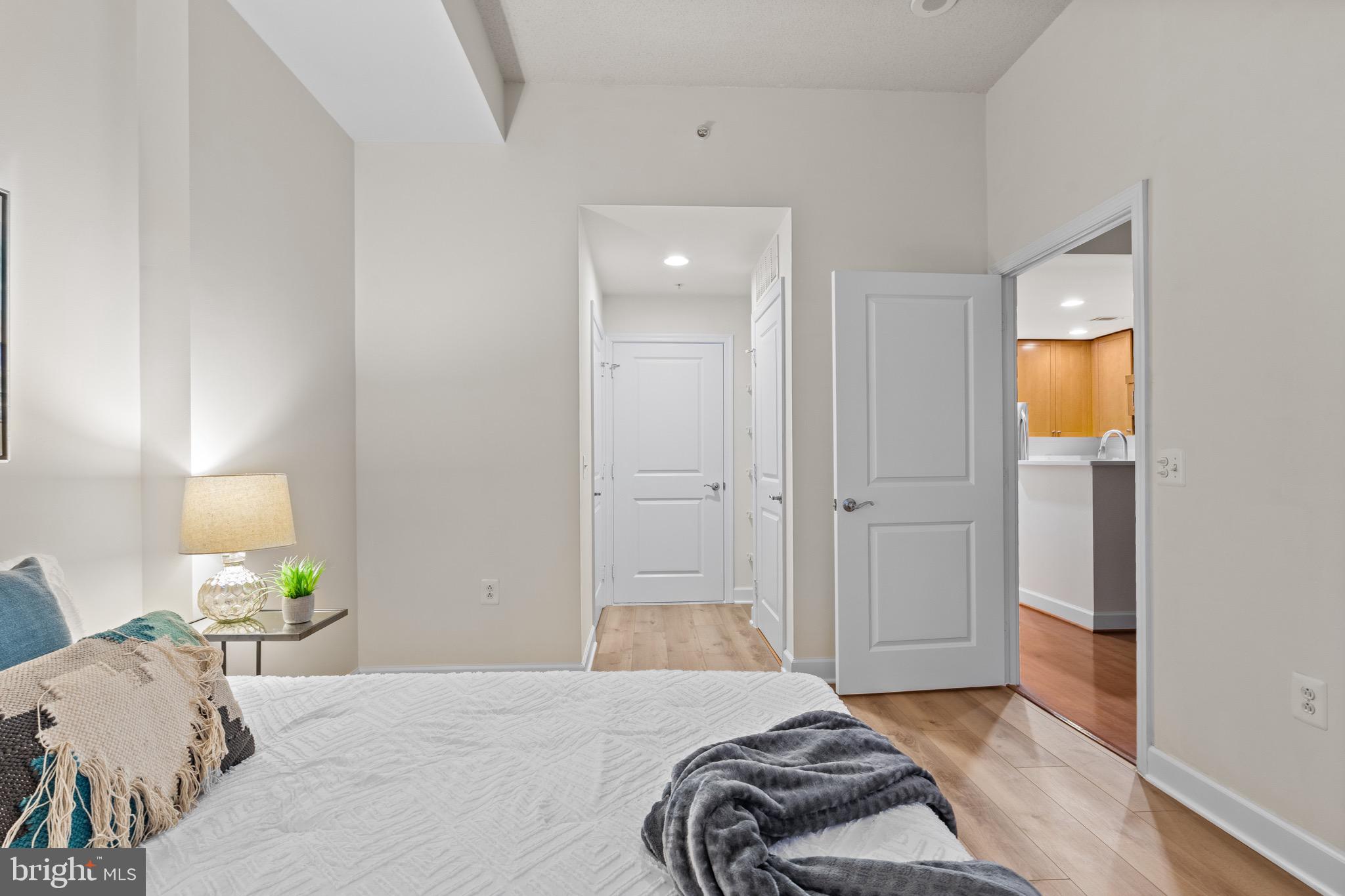 3650 South Glebe Road, Unit 1147 Arlington, VA 22202 - Photo 13 of 51 a bedroom with a bed and a lamp