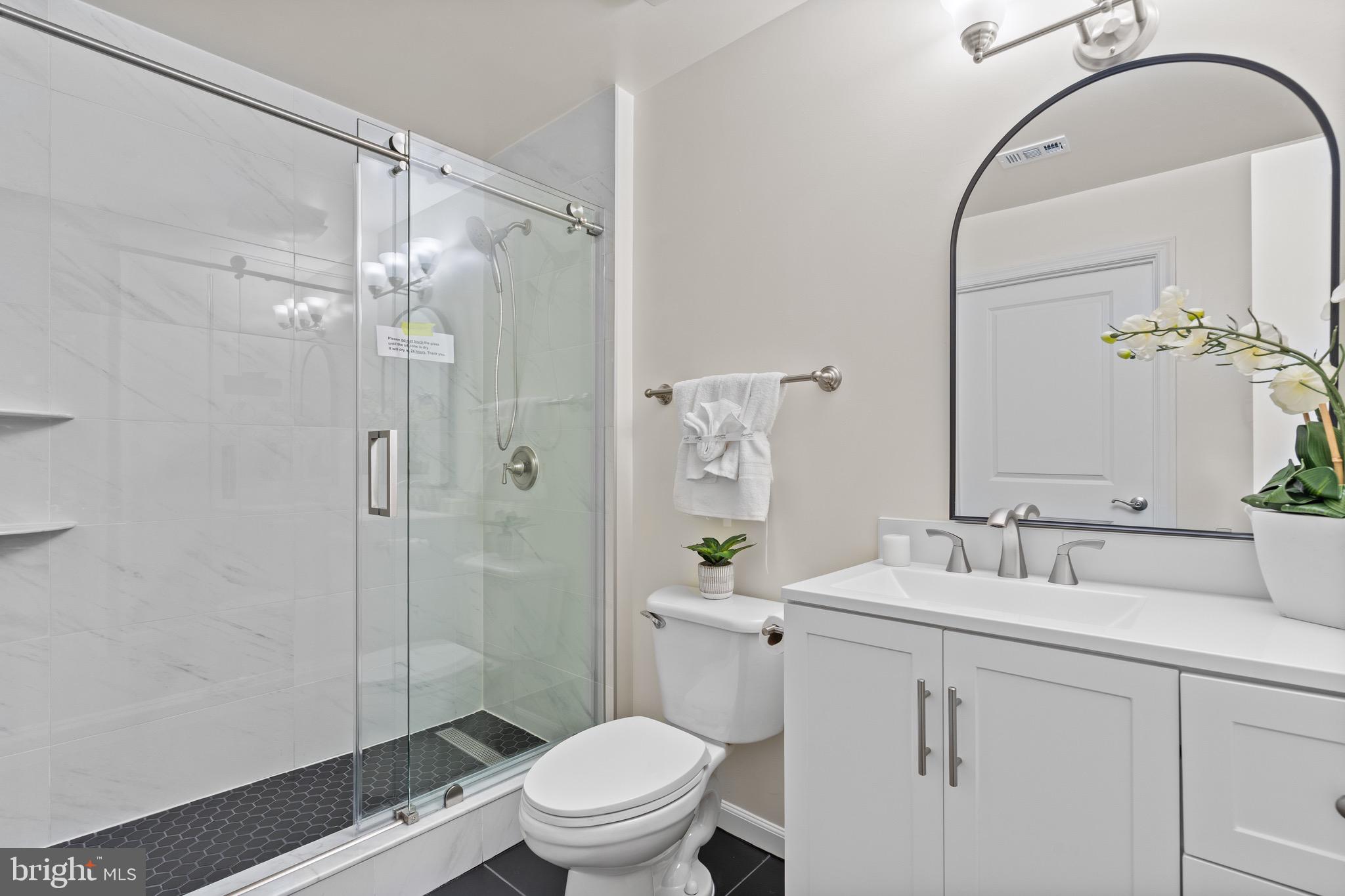 3650 South Glebe Road, Unit 1147 Arlington, VA 22202 - Photo 16 of 51 a bathroom with a sink a toilet and shower