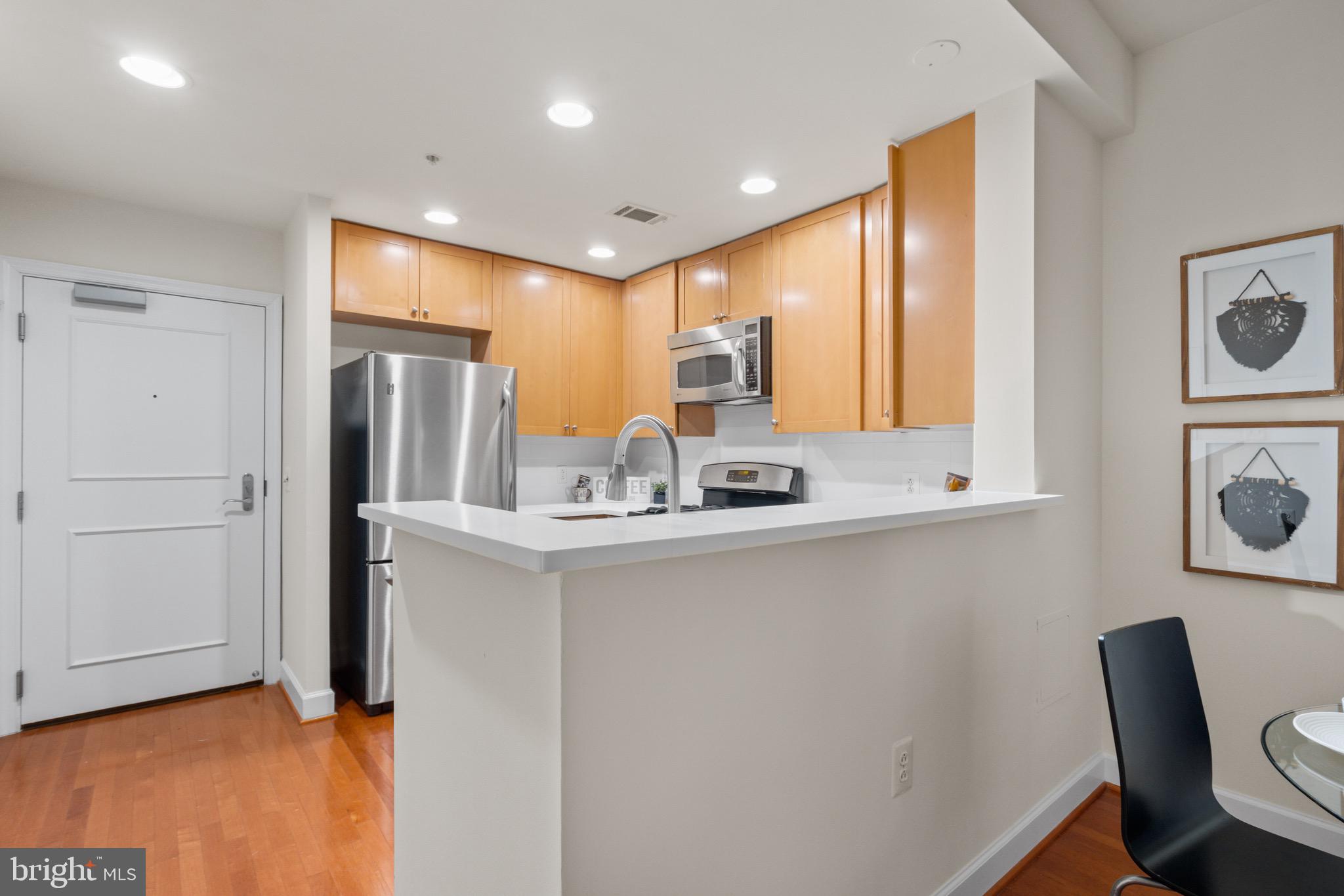 3650 South Glebe Road, Unit 1147 Arlington, VA 22202 - Photo 20 of 51 a kitchen with stainless steel appliances a refrigerator and cabinets
