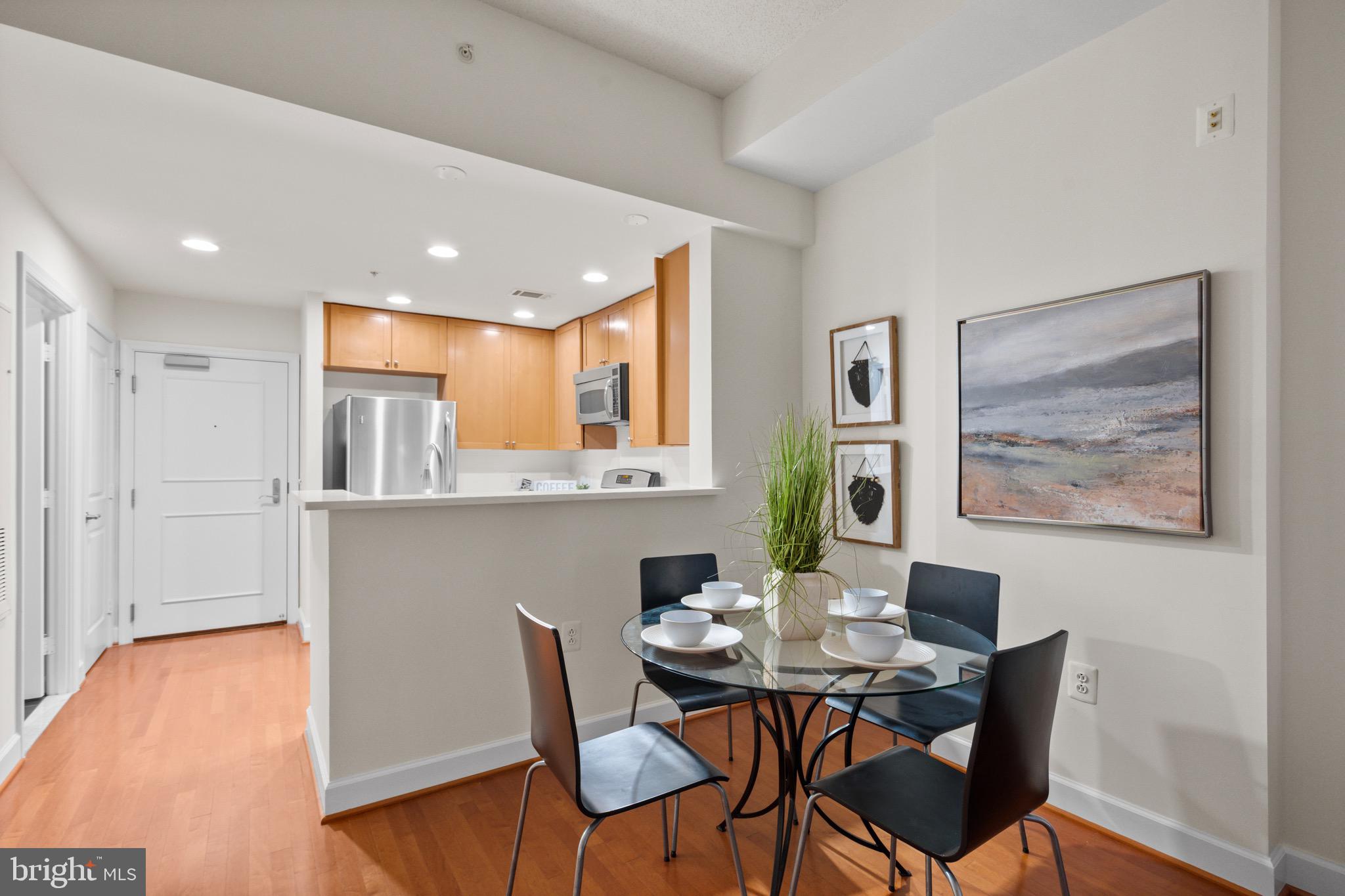3650 South Glebe Road, Unit 1147 Arlington, VA 22202 - Photo 21 of 51 a view of a dining room with furniture and wooden floor