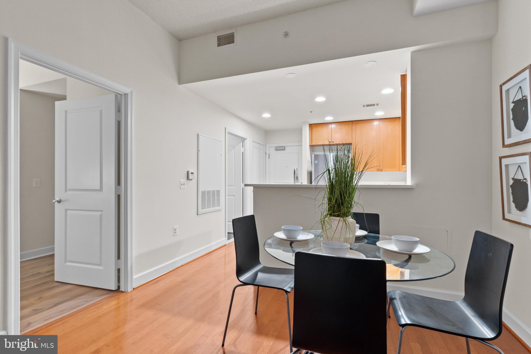 3650 South Glebe Road, Unit 1147 Arlington, VA 22202 - Photo 22 of 51 a view of a dining room with furniture window and wooden floor