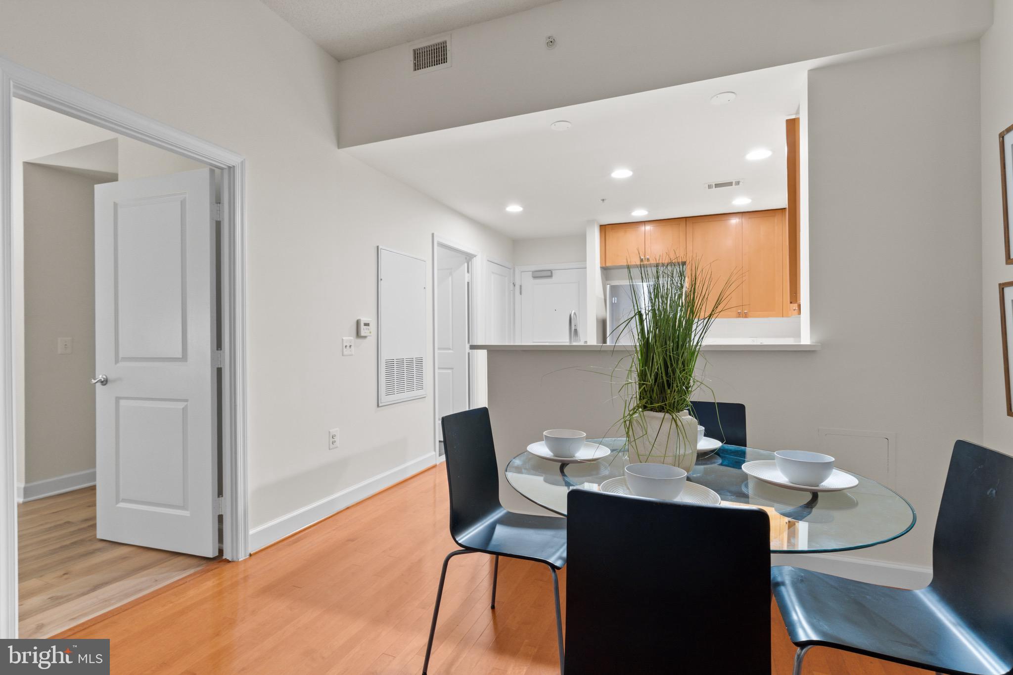 3650 South Glebe Road, Unit 1147 Arlington, VA 22202 - Photo 25 of 51 a view of a dining room with furniture window and wooden floor