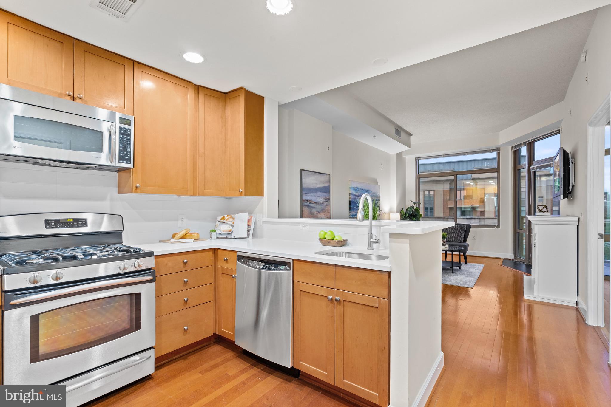 3650 South Glebe Road, Unit 1147 Arlington, VA 22202 - Photo 6 of 51 a kitchen with a sink stove and cabinets