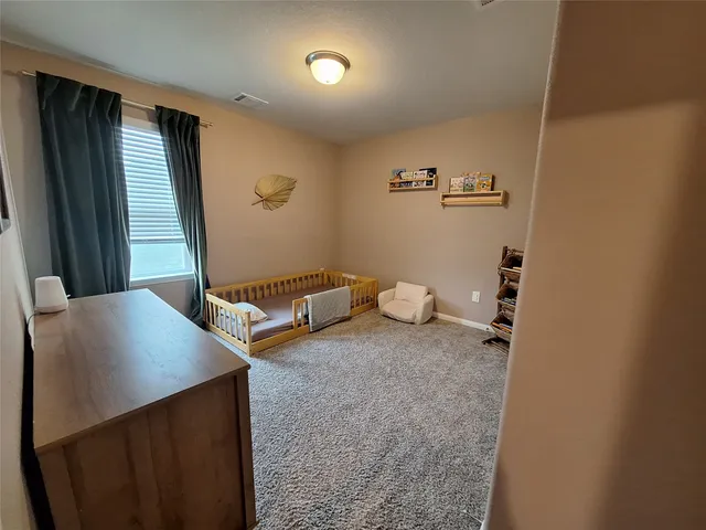 a view of a storage & utility room with two washing machine