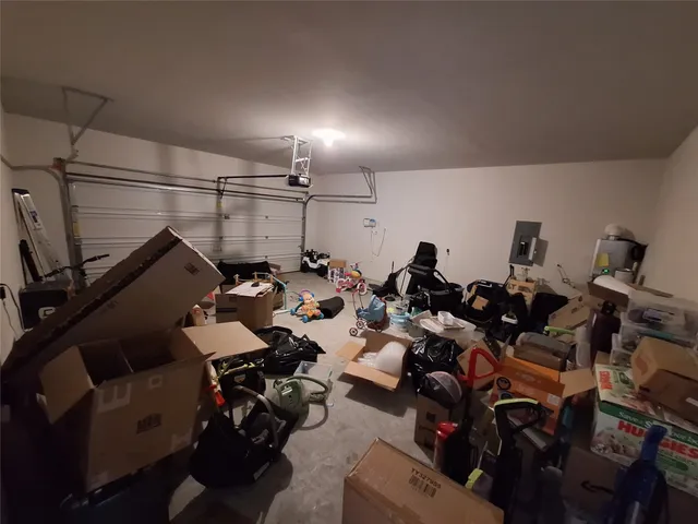 a view of a patio with table and chairs potted plants with wooden floor and fence