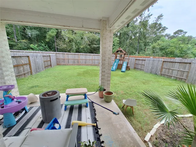 a front view of a house with a garden and parking