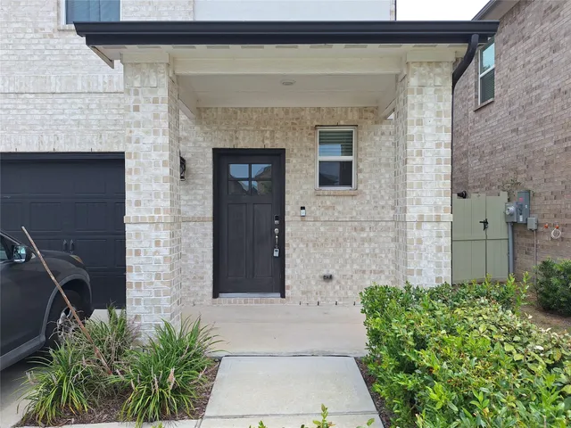 a front view of a house with a garage