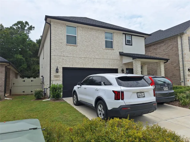 a house view with a garden space