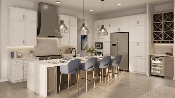 a large white kitchen with kitchen island a sink stainless steel appliances and cabinets