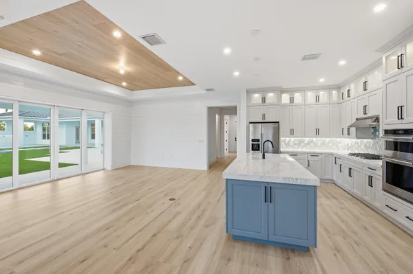 a view of kitchen with wooden floor