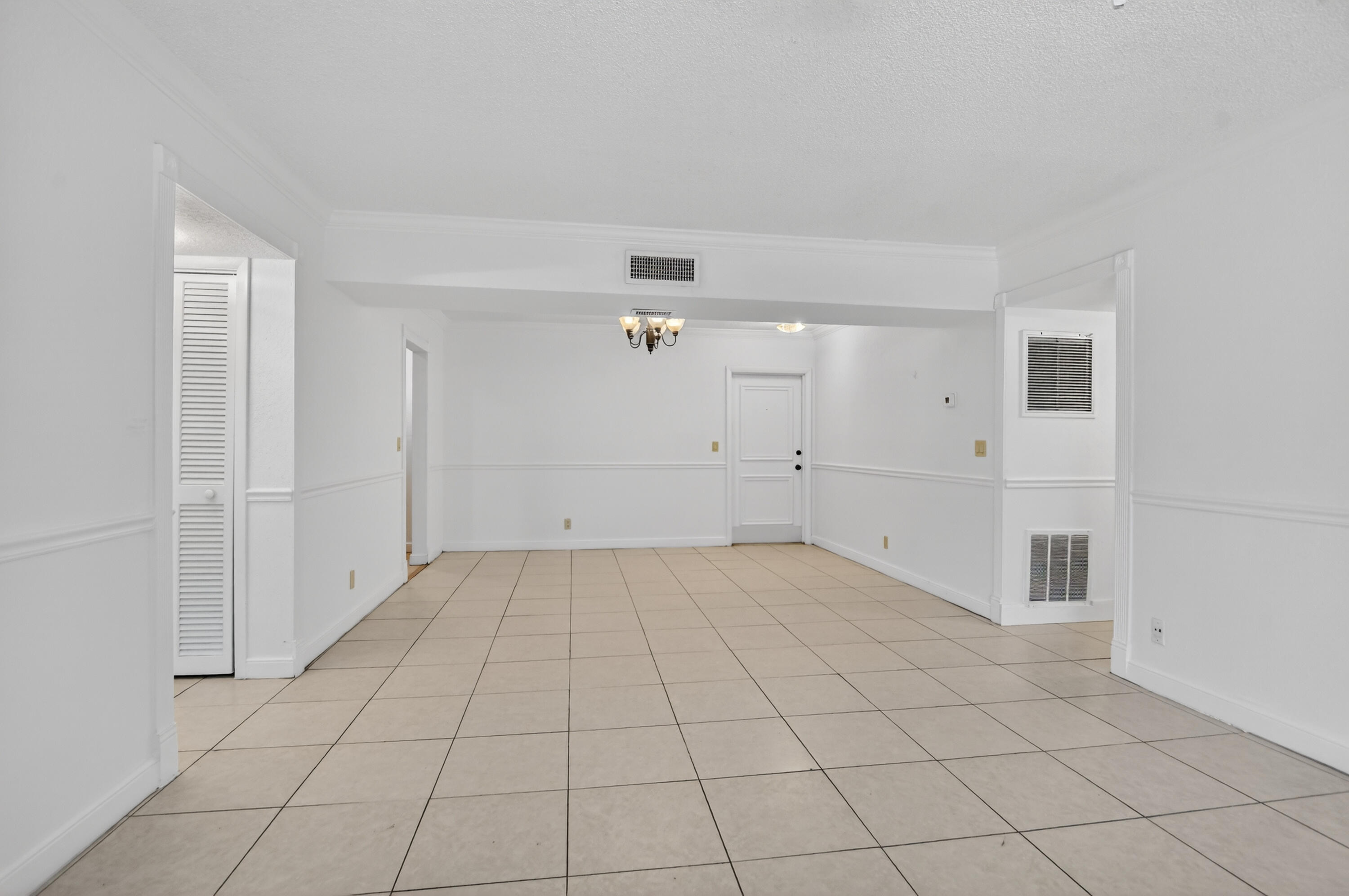 636 Northwest 13th Street, Unit 110 Boca Raton, FL 33486 - Photo 11 of 35 an empty room with white walls
