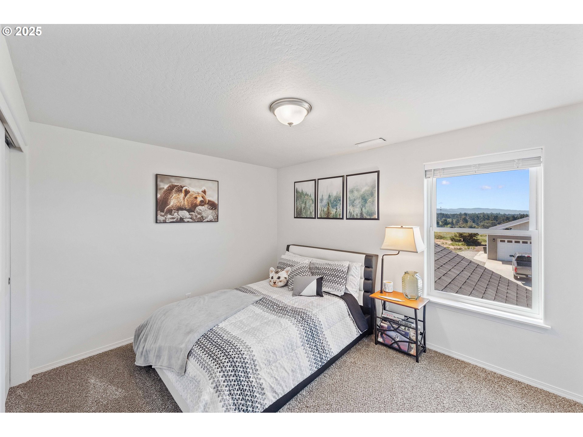 764 Seacrest Drive Bandon, OR 97411 - Photo 16 of 43 a bedroom with a bed and a window