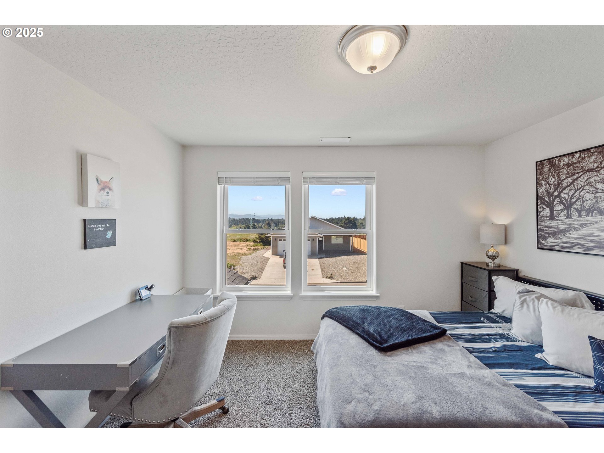 764 Seacrest Drive Bandon, OR 97411 - Photo 19 of 43 a living room with furniture and a window