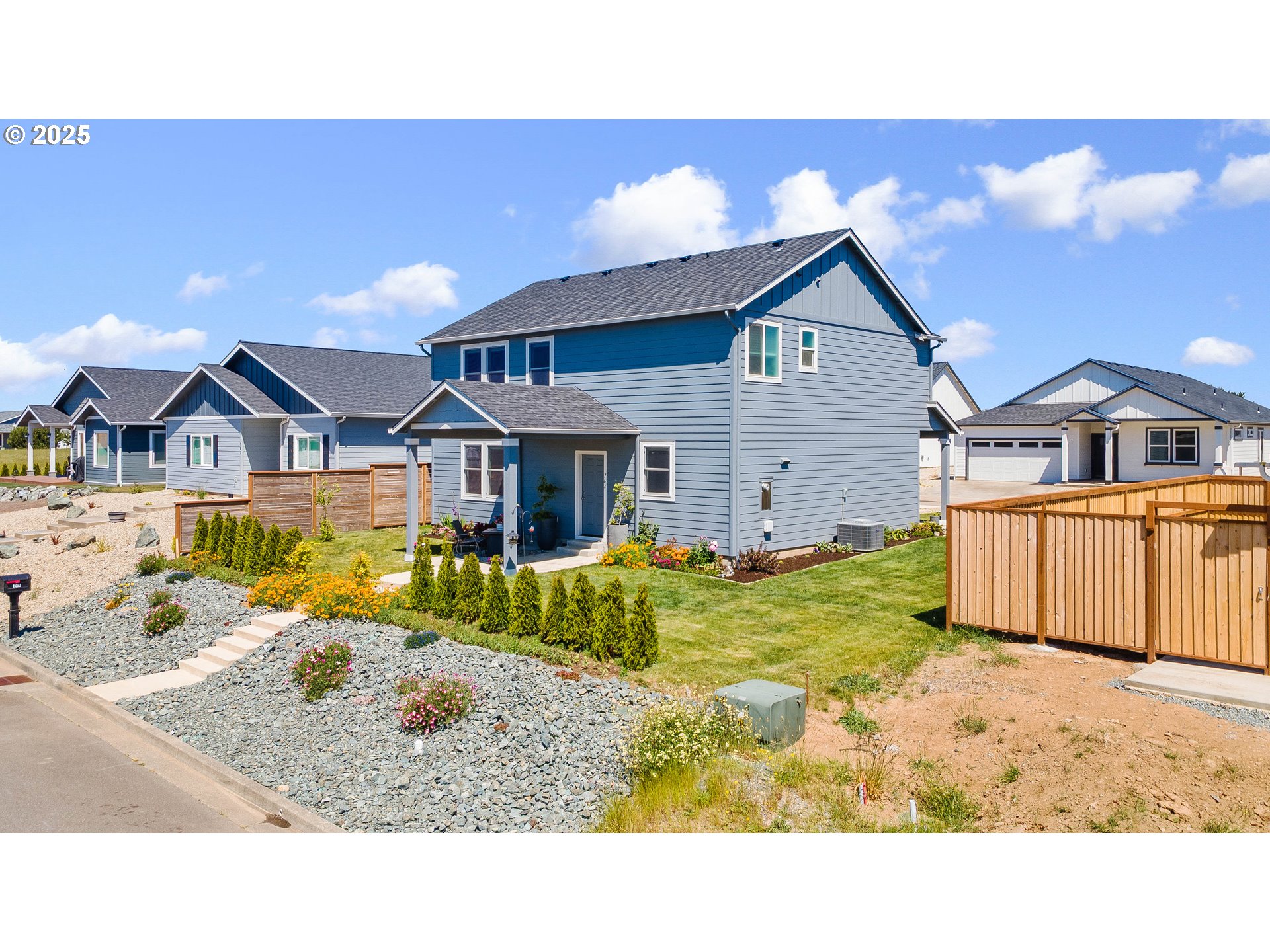 764 Seacrest Drive Bandon, OR 97411 - Photo 2 of 43 a view of a house with a big yard