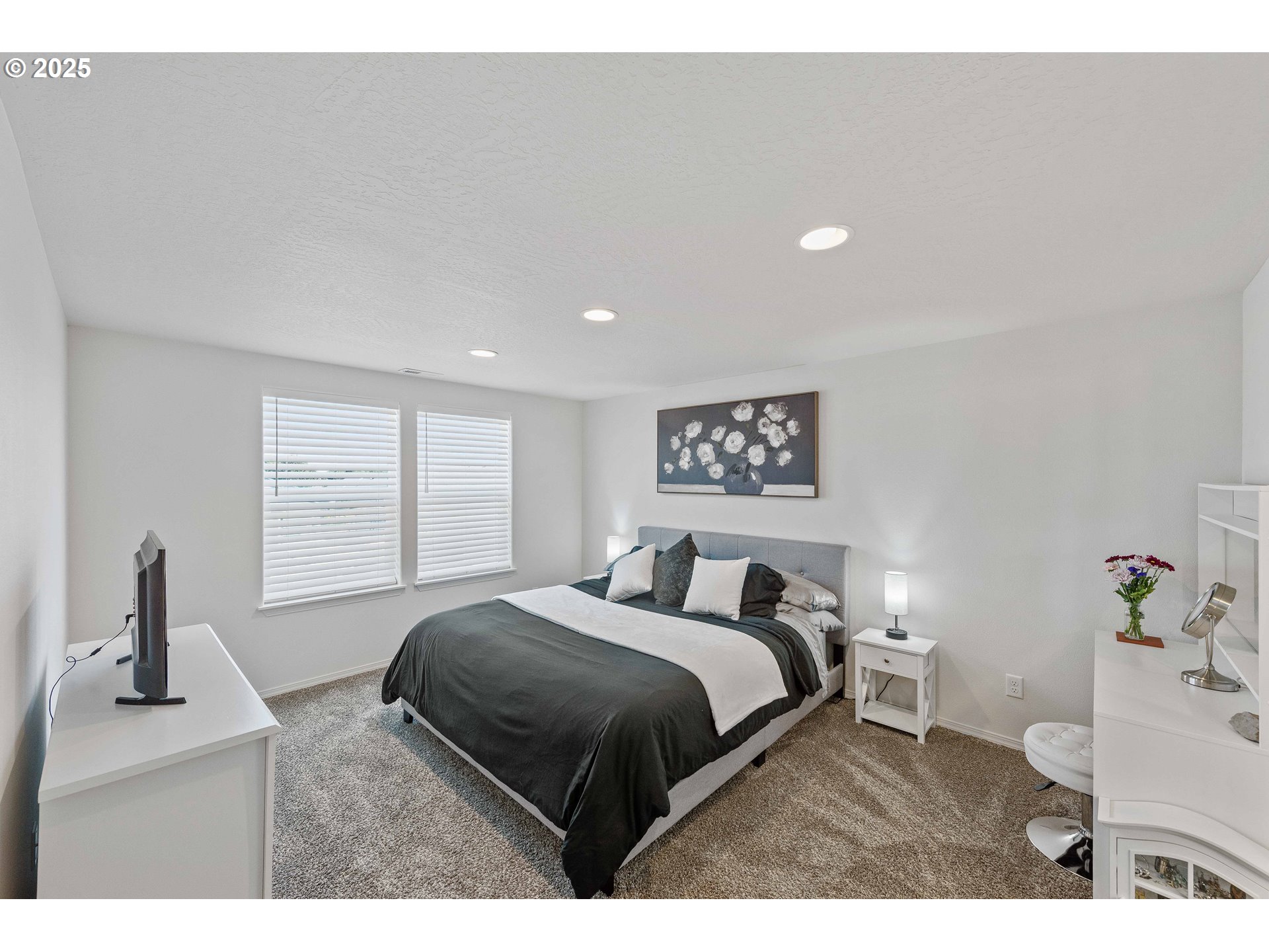 764 Seacrest Drive Bandon, OR 97411 - Photo 22 of 43 a bedroom with a bed and a night stand