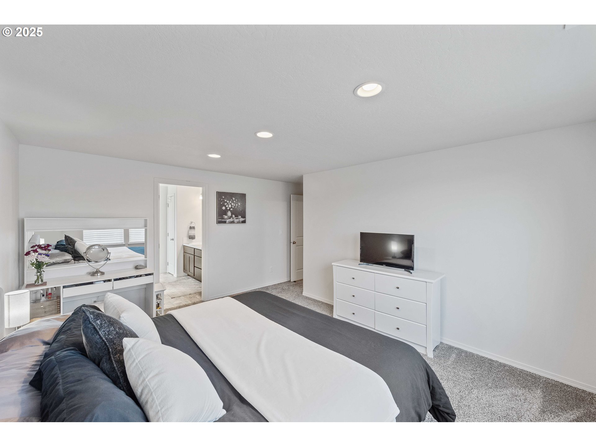 764 Seacrest Drive Bandon, OR 97411 - Photo 23 of 43 a bedroom with a bed and a television