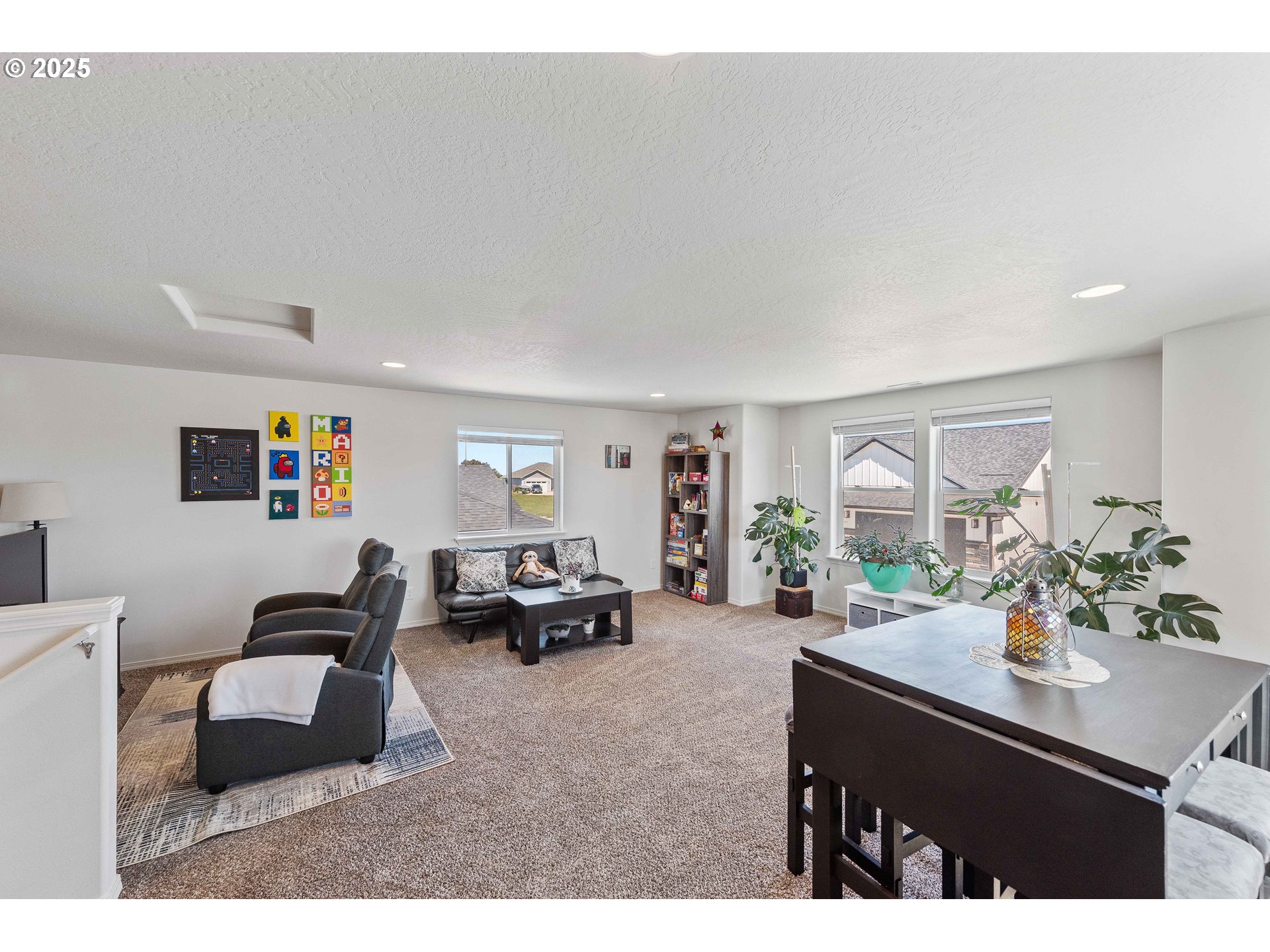 764 Seacrest Drive Bandon, OR 97411 - Photo 32 of 43 a living room with furniture and a potted plant