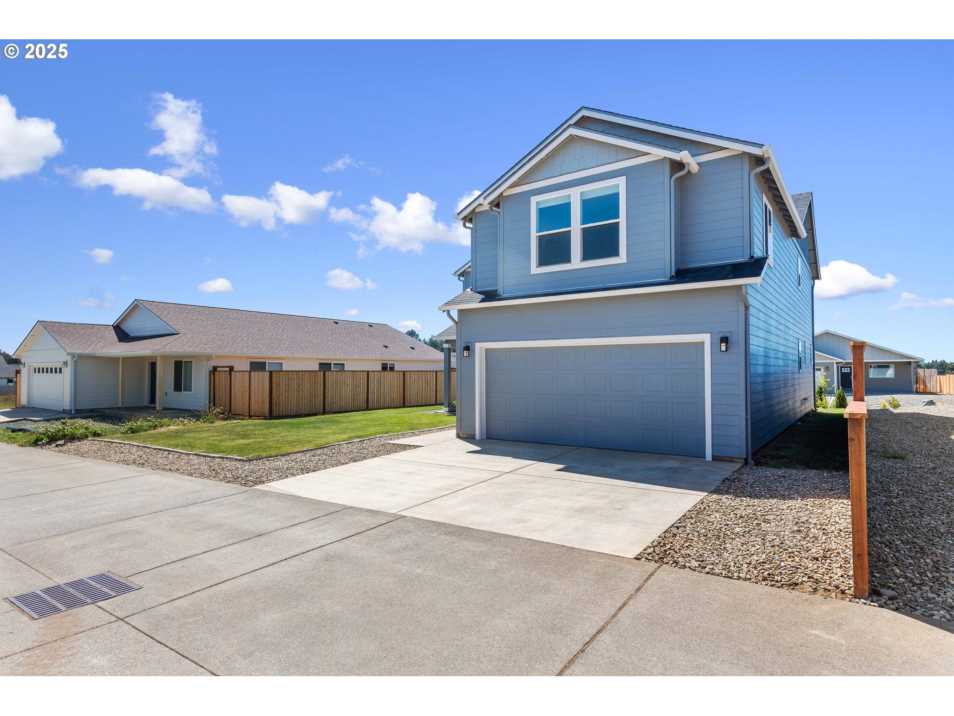 764 Seacrest Drive Bandon, OR 97411 - Photo 38 of 43 a front view of a house with a yard