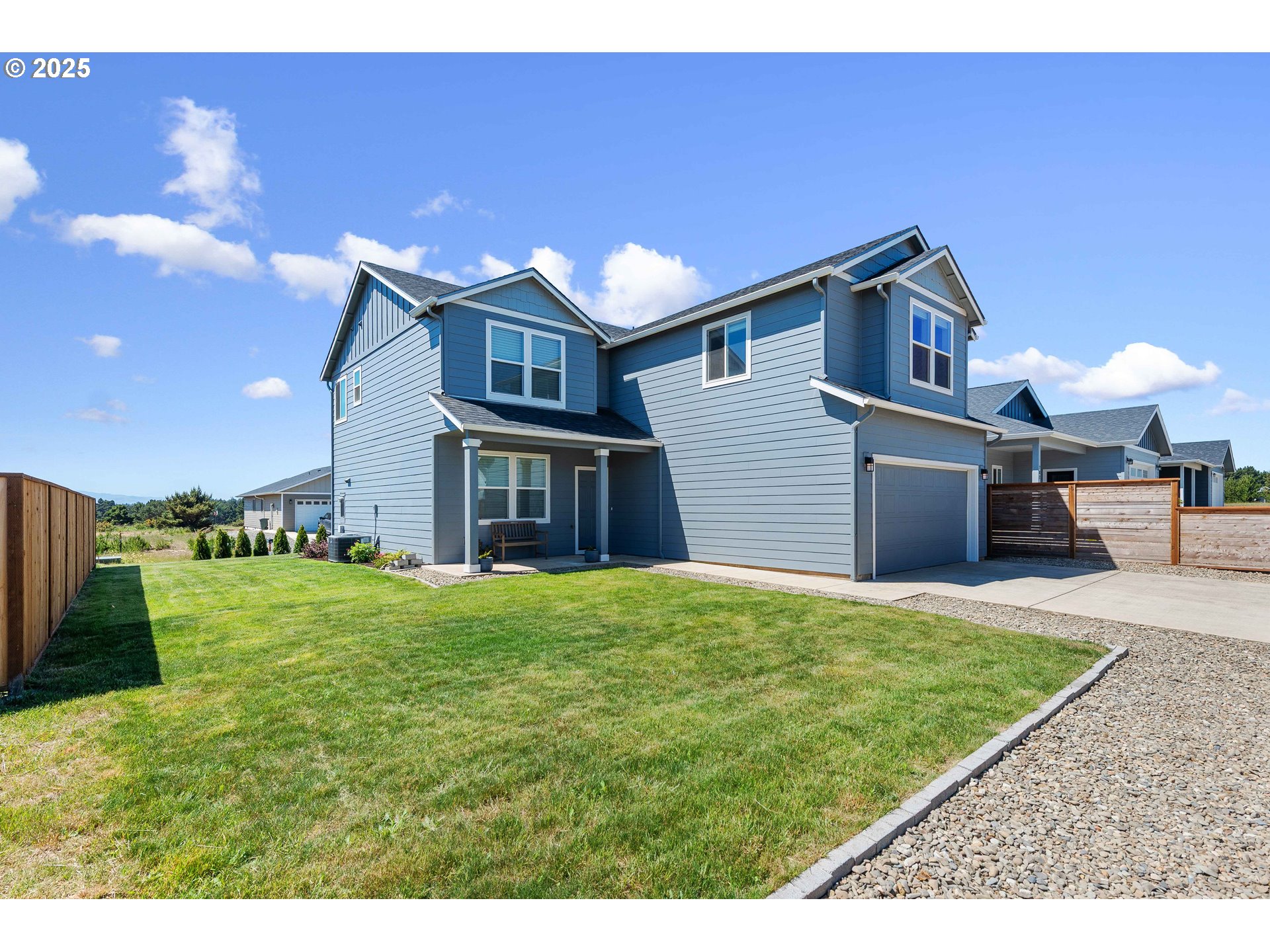 764 Seacrest Drive Bandon, OR 97411 - Photo 40 of 43 a front view of a house with a yard