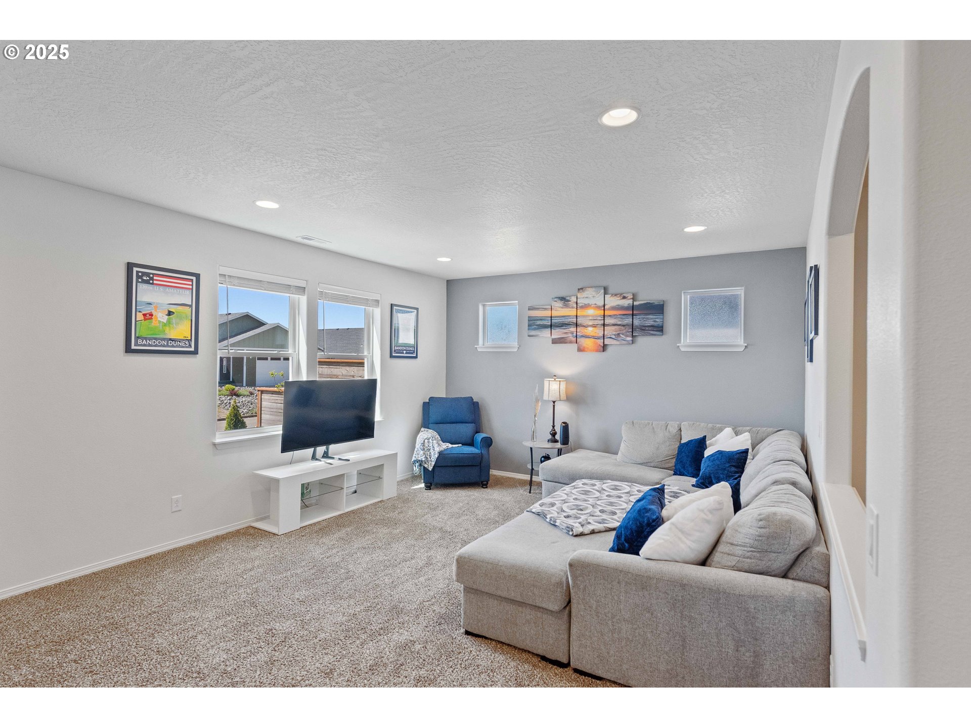 764 Seacrest Drive Bandon, OR 97411 - Photo 4 of 43 a living room with furniture and a flat screen tv