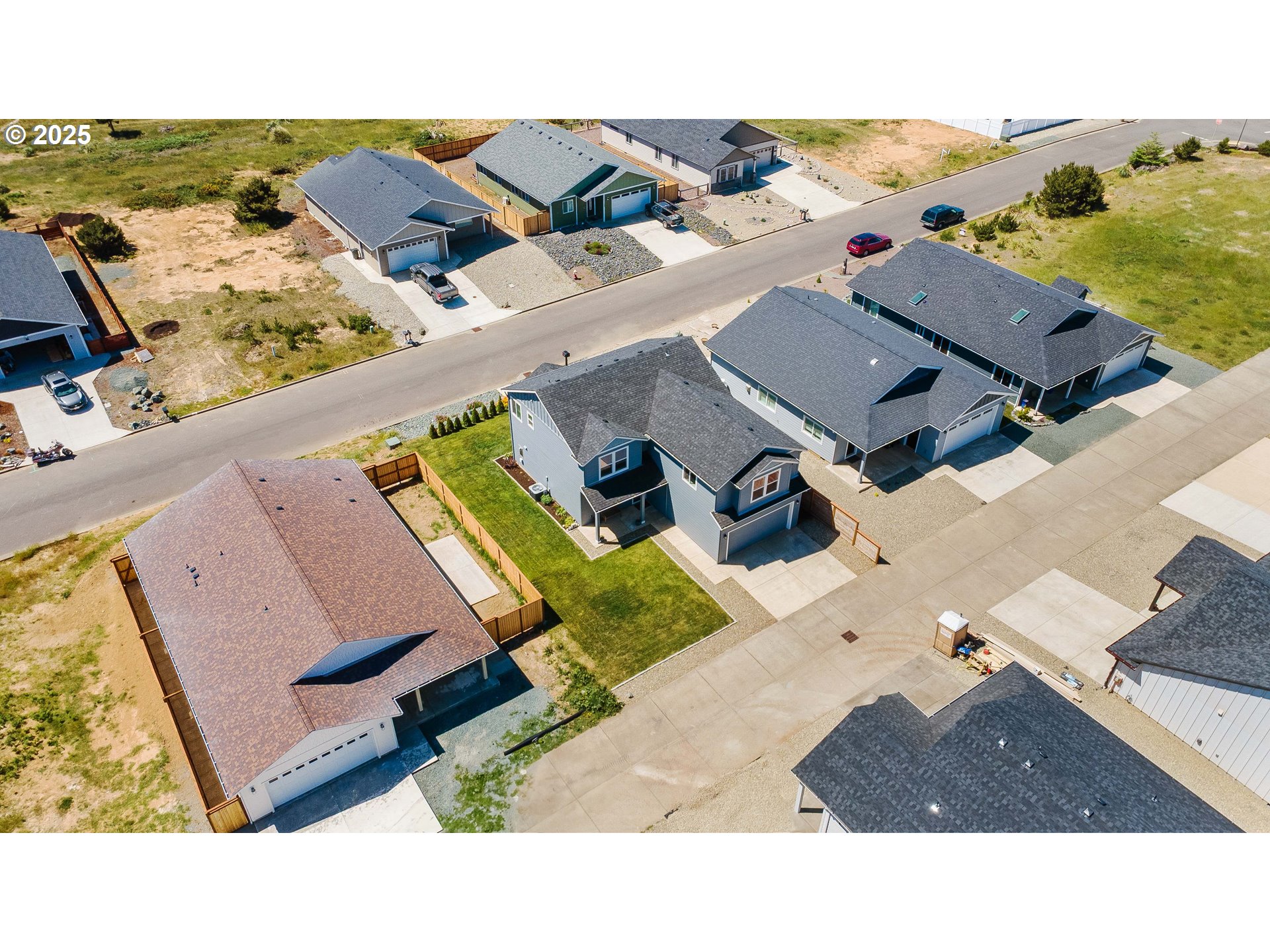 764 Seacrest Drive Bandon, OR 97411 - Photo 43 of 43 an aerial view of a house with a garden