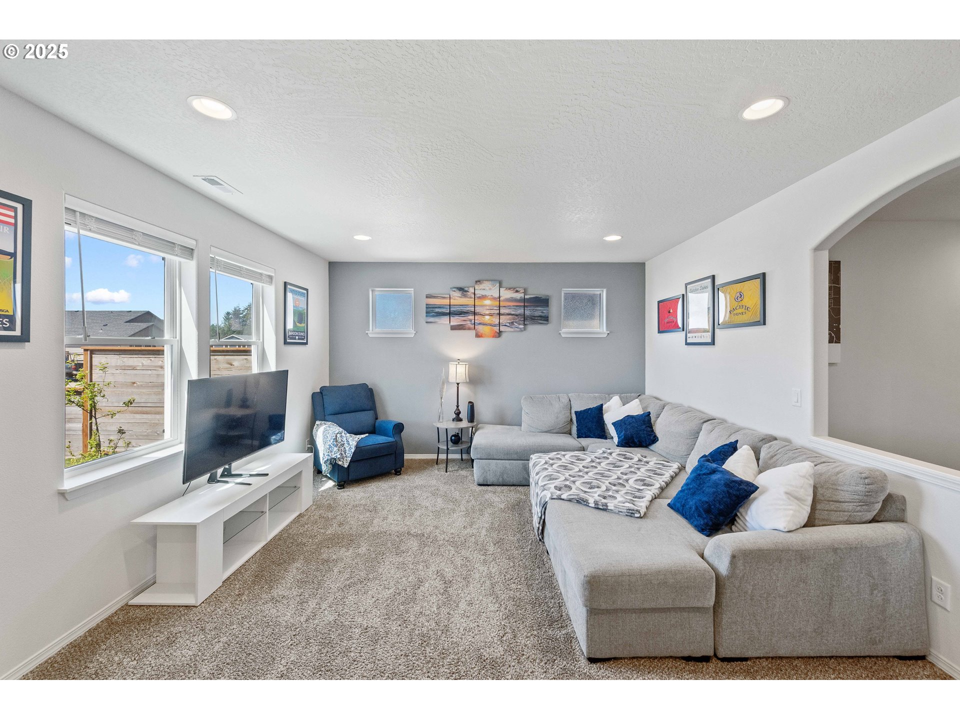 764 Seacrest Drive Bandon, OR 97411 - Photo 6 of 43 a living room with furniture and a large window
