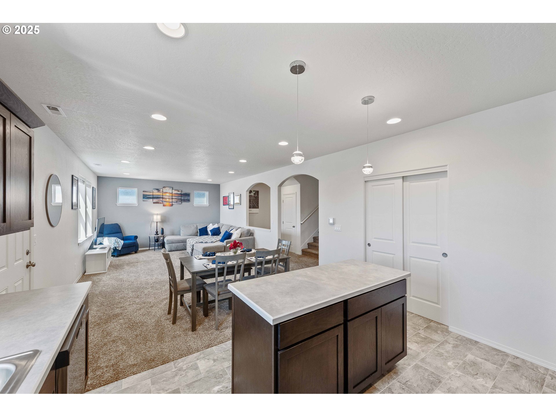 764 Seacrest Drive Bandon, OR 97411 - Photo 7 of 43 a kitchen with a sink refrigerator and cabinets