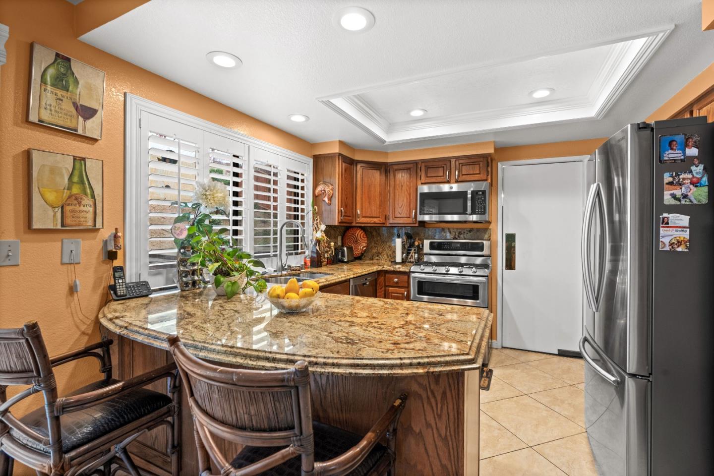 3040 Cedar Ridge Court San Jose, CA 95148 - Photo 16 of 40 a kitchen with a table chairs refrigerator and cabinets