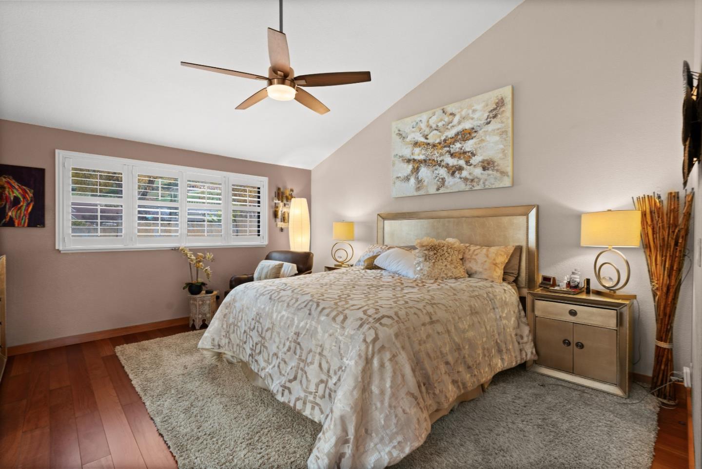 3040 Cedar Ridge Court San Jose, CA 95148 - Photo 22 of 40 a bedroom with a bed and a chandelier