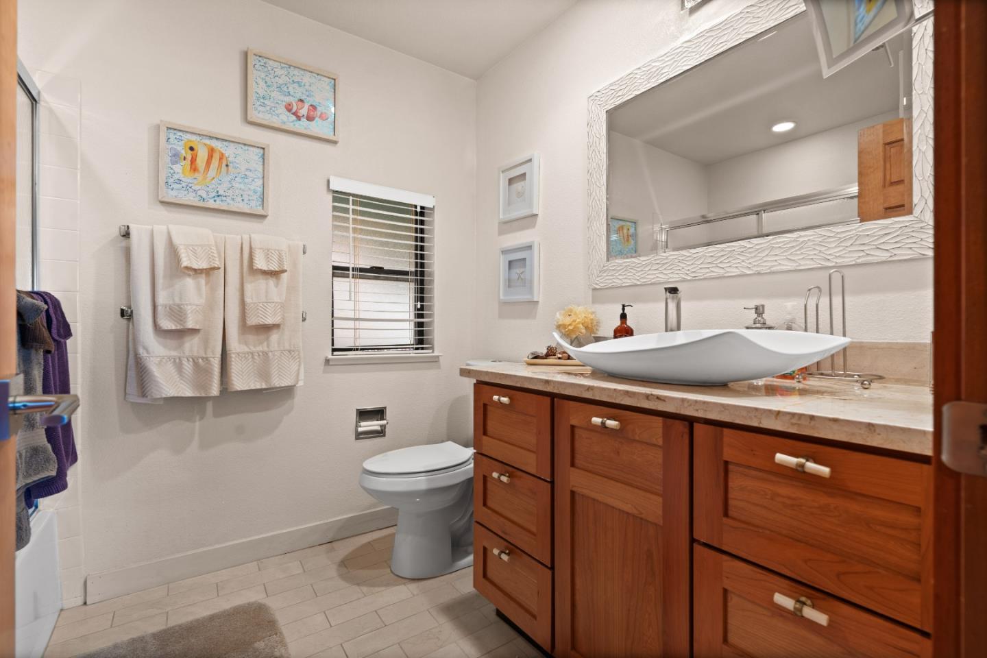 3040 Cedar Ridge Court San Jose, CA 95148 - Photo 27 of 40 a bathroom with a toilet sink and mirror