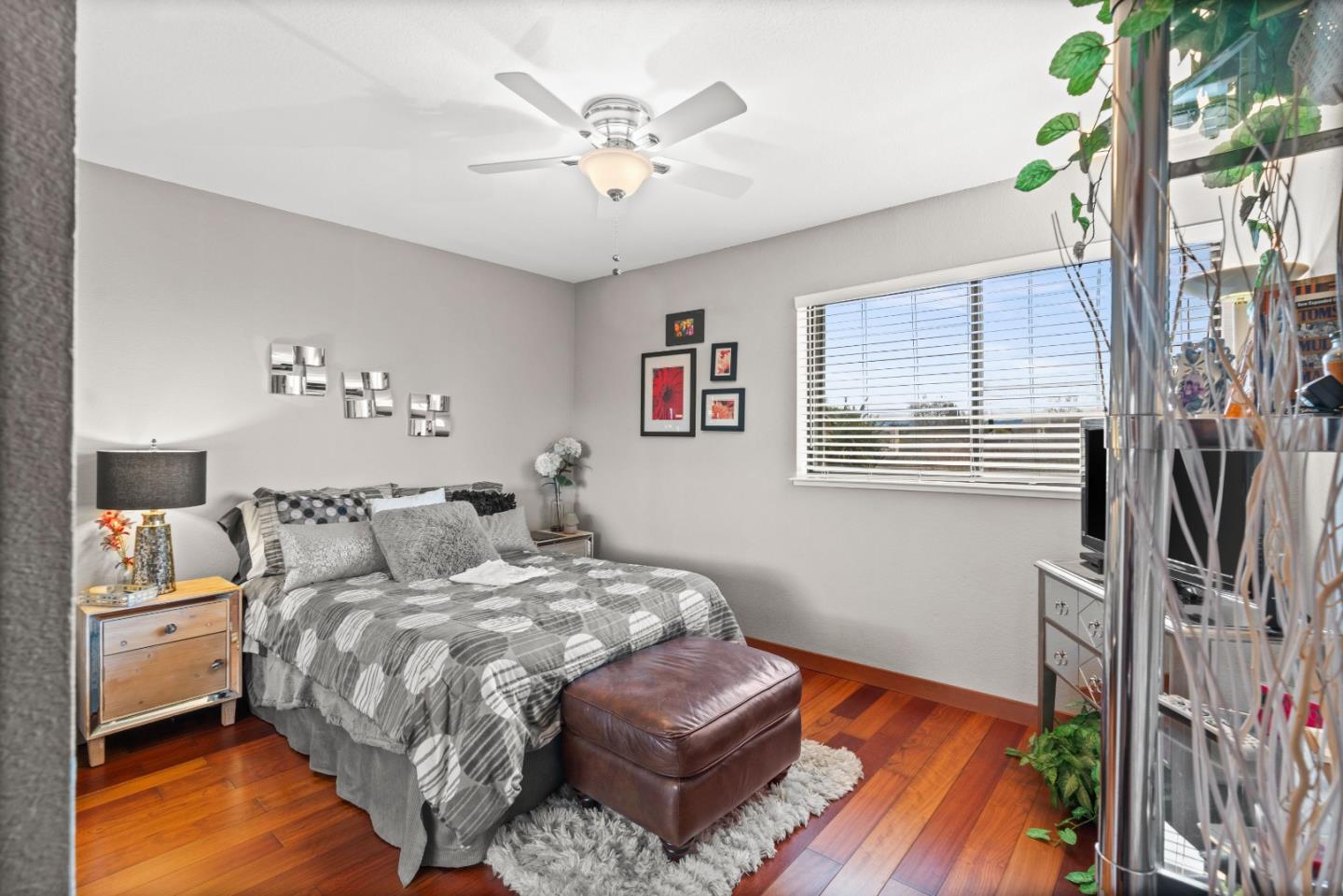 3040 Cedar Ridge Court San Jose, CA 95148 - Photo 29 of 40 a bed room with a bed and a chandelier