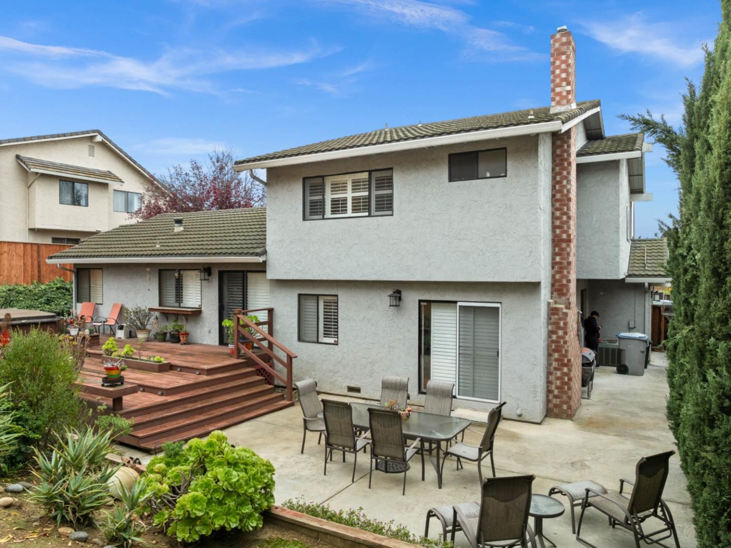 3040 Cedar Ridge Court San Jose, CA 95148 - Photo 5 of 40 a view of a patio with table and chairs potted plants and a large tree