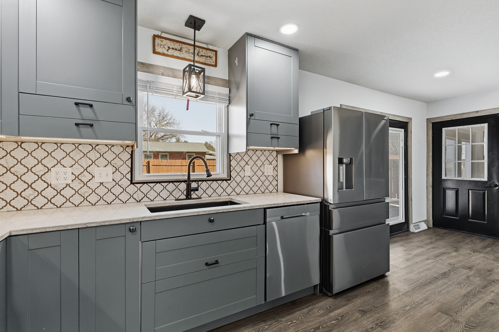 11622 27th Street West Milan, IL 61264 - Photo 8 of 49 a kitchen with stainless steel appliances a refrigerator and a sink