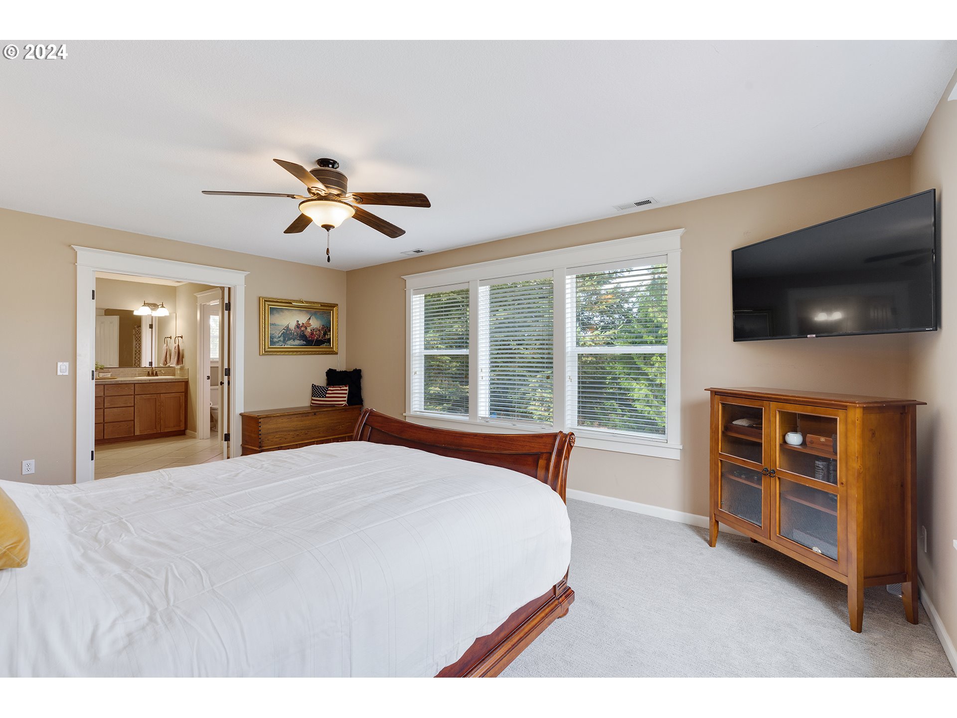 18445 Brookside Road Oregon City, OR 97045 - Photo 33 of 46 a bedroom with a bed and a flat screen tv