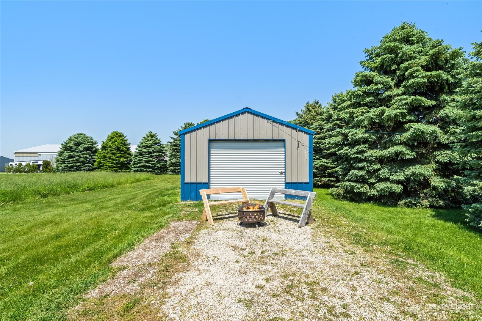 13495 Fennel Road Newark, IL 60541 - Photo 38 of 43 a backyard of a house with table and chairs