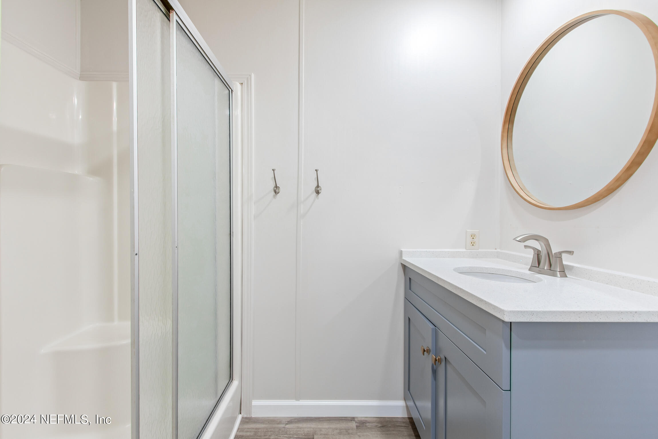 1650 Natalie Road St. Augustine, FL 32084 - Photo 18 of 44 a bathroom with a sink and a mirror