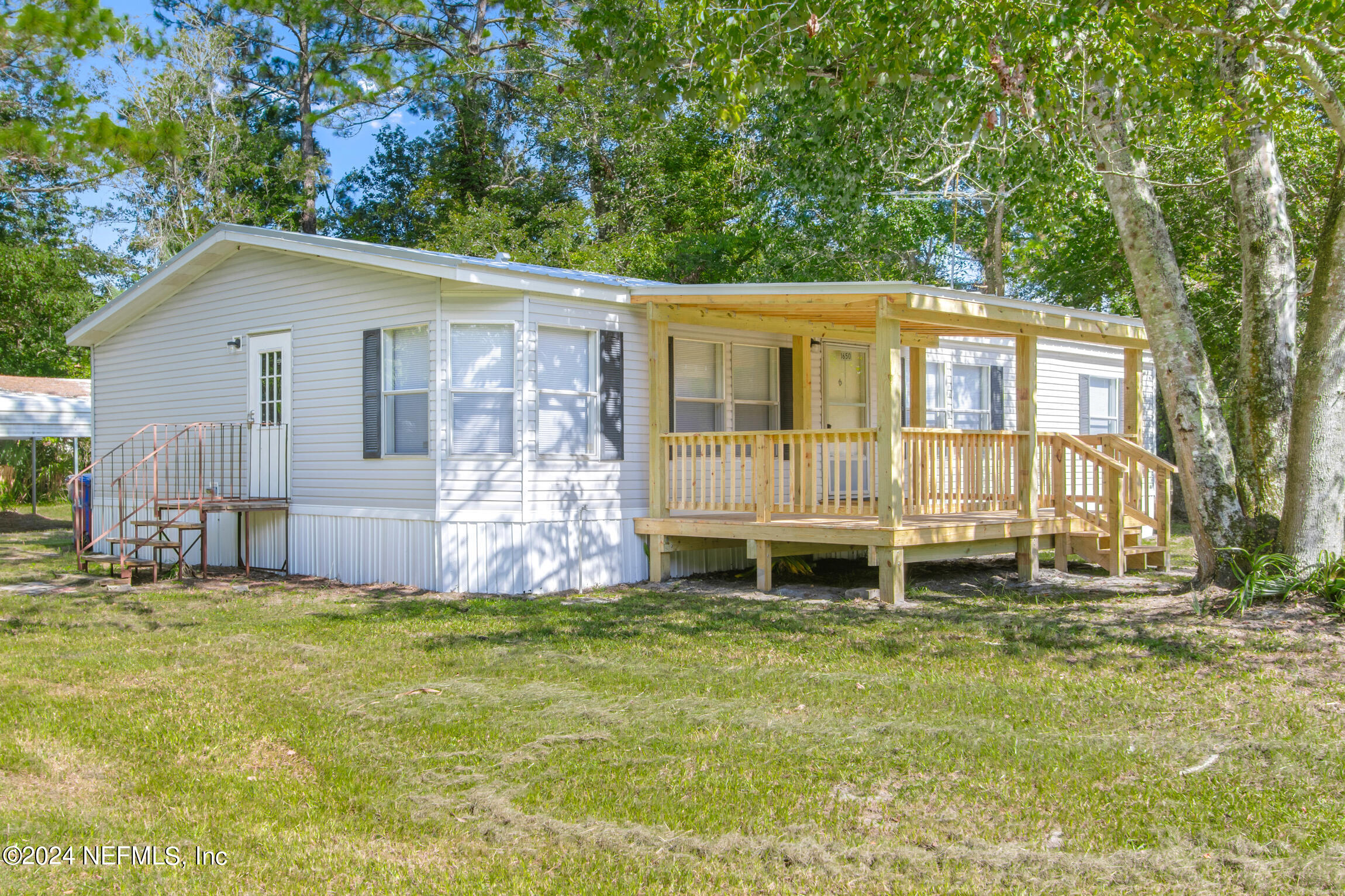 1650 Natalie Road St. Augustine, FL 32084 - Photo 2 of 44 a view of a house with a yard