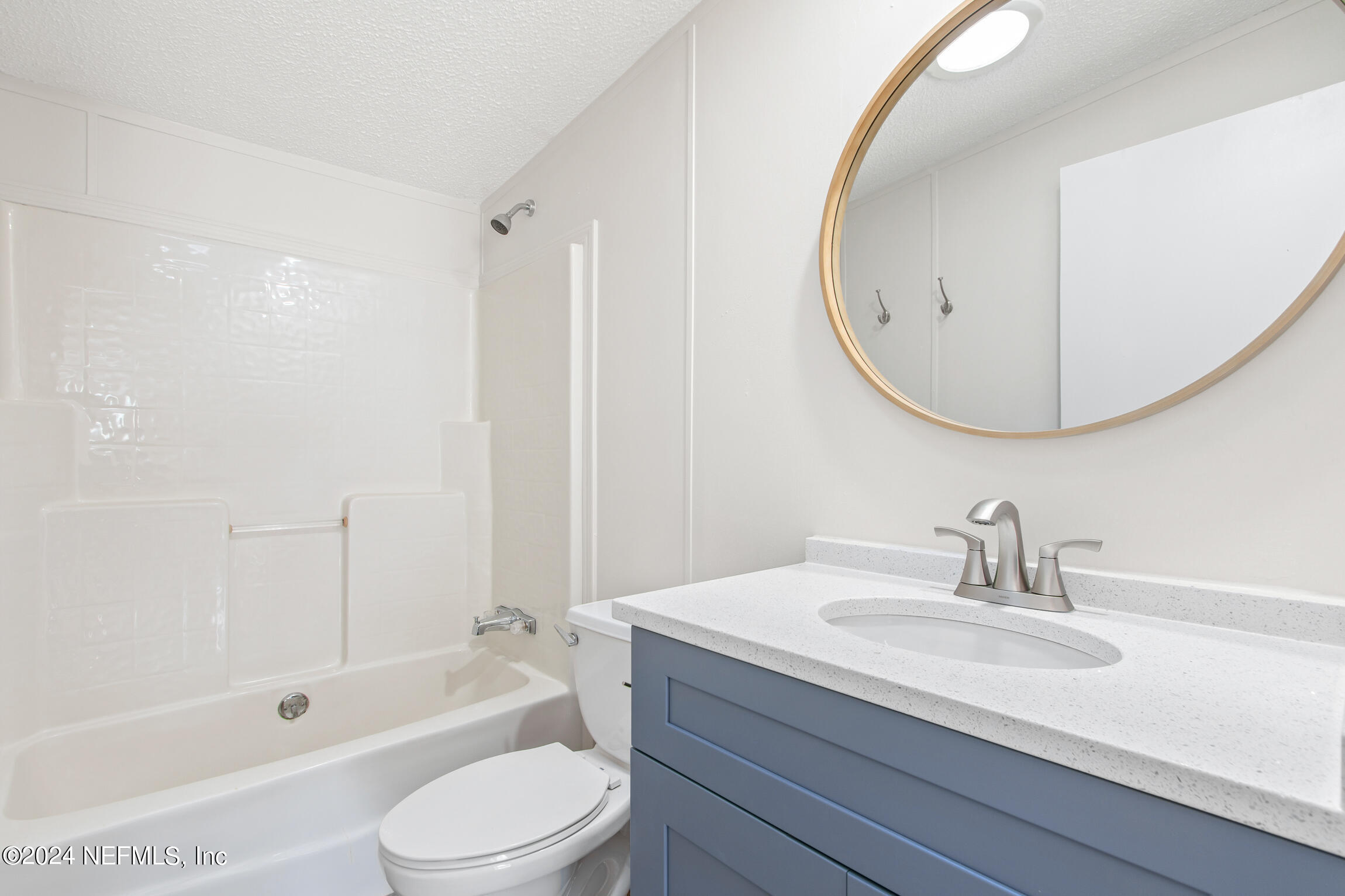 1650 Natalie Road St. Augustine, FL 32084 - Photo 21 of 44 a bathroom with a sink a toilet and a mirror
