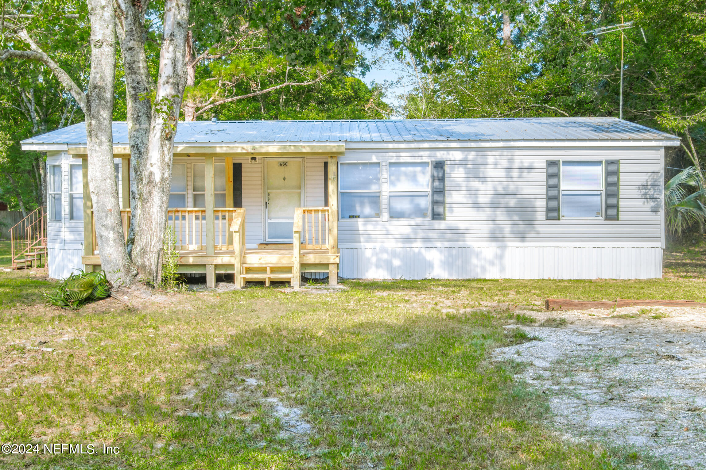 1650 Natalie Road St. Augustine, FL 32084 - Photo 24 of 44 a view of a house with a swimming pool and a yard