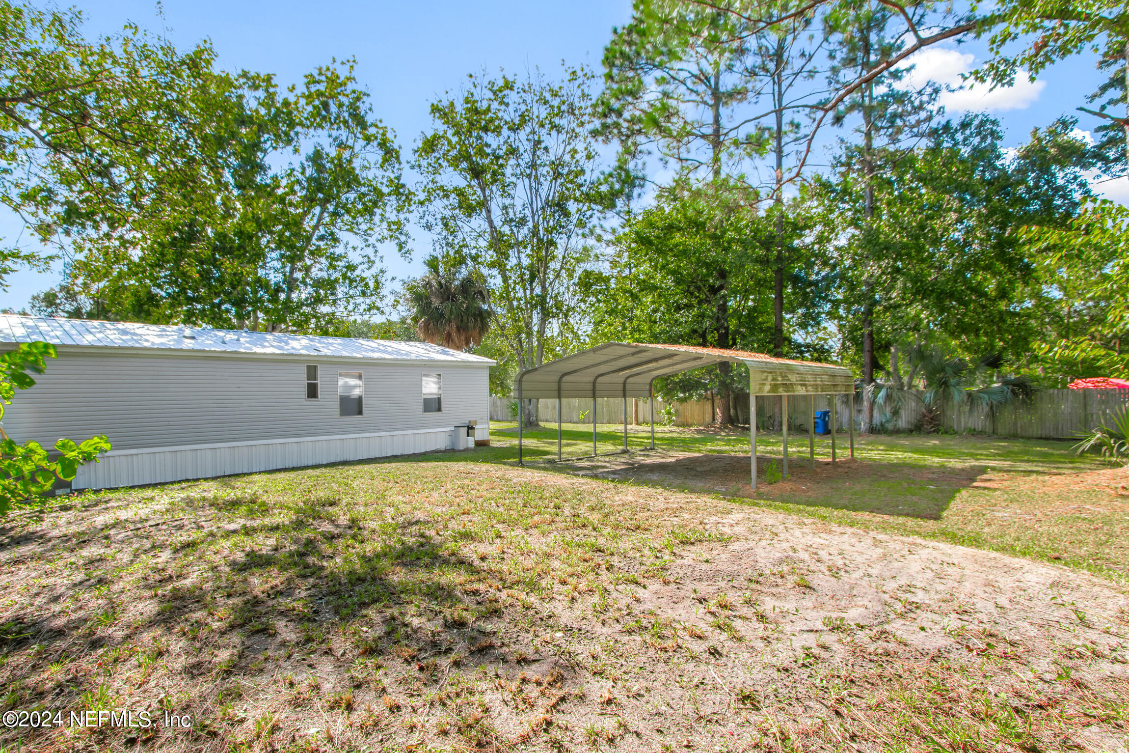 1650 Natalie Road St. Augustine, FL 32084 - Photo 32 of 44 a view of a yard in front of a house with a large tree