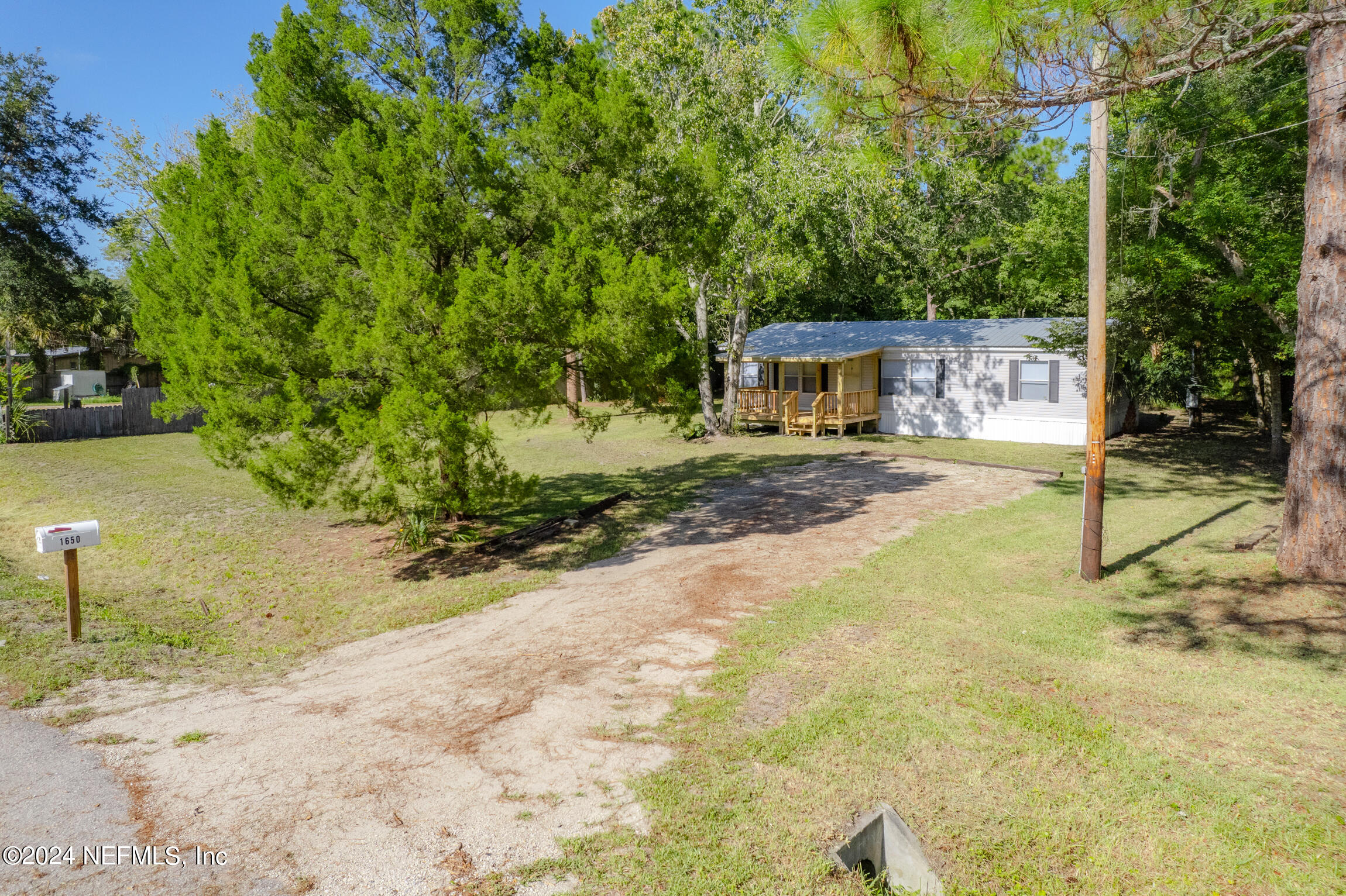 1650 Natalie Road St. Augustine, FL 32084 - Photo 35 of 44 a view of a yard with plants and trees