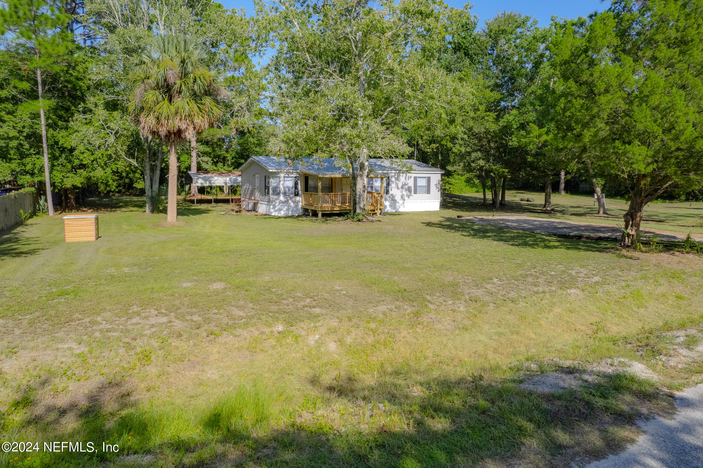1650 Natalie Road St. Augustine, FL 32084 - Photo 36 of 44 a front view of a house with a yard and trees