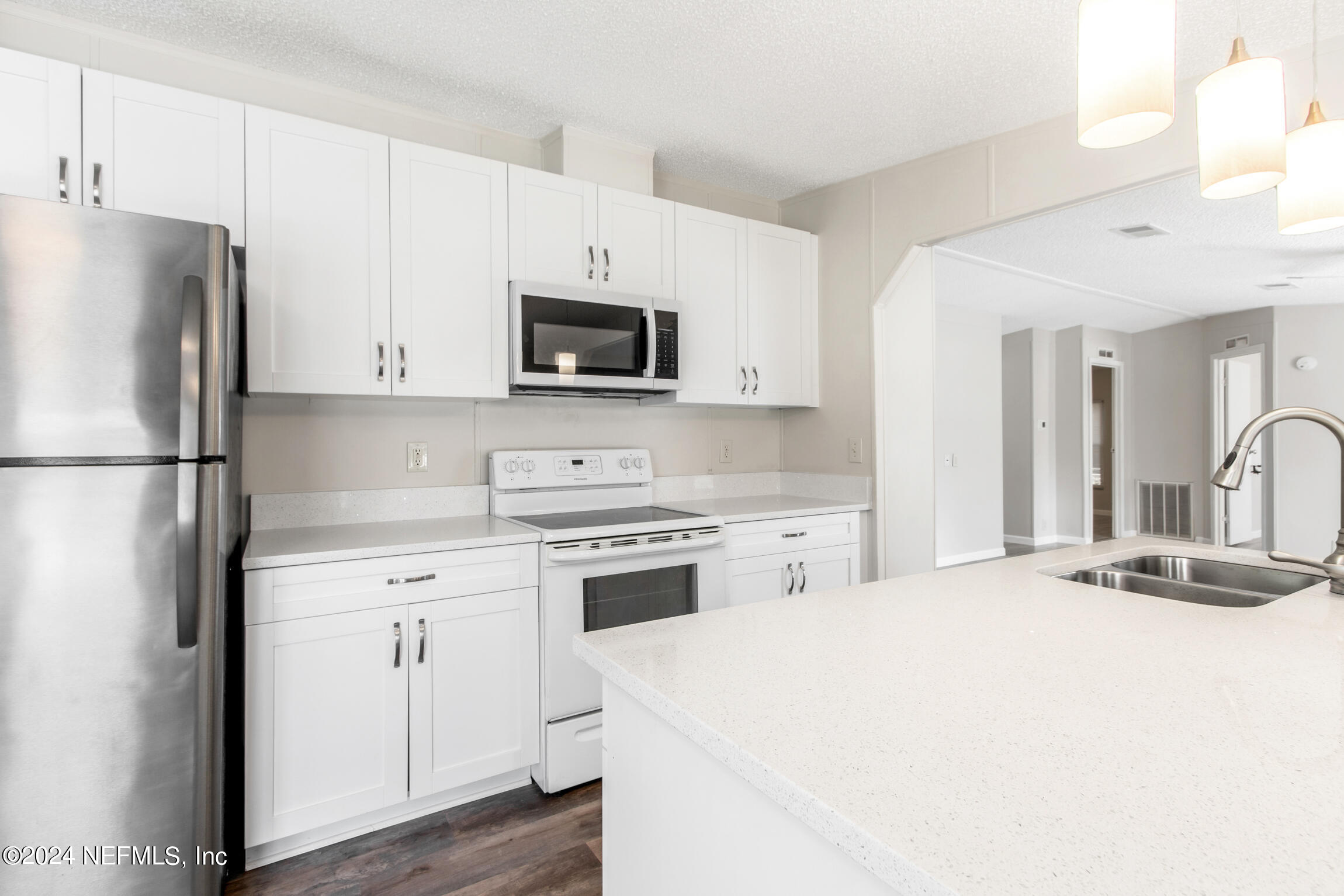 1650 Natalie Road St. Augustine, FL 32084 - Photo 6 of 44 a kitchen with a refrigerator stove and microwave
